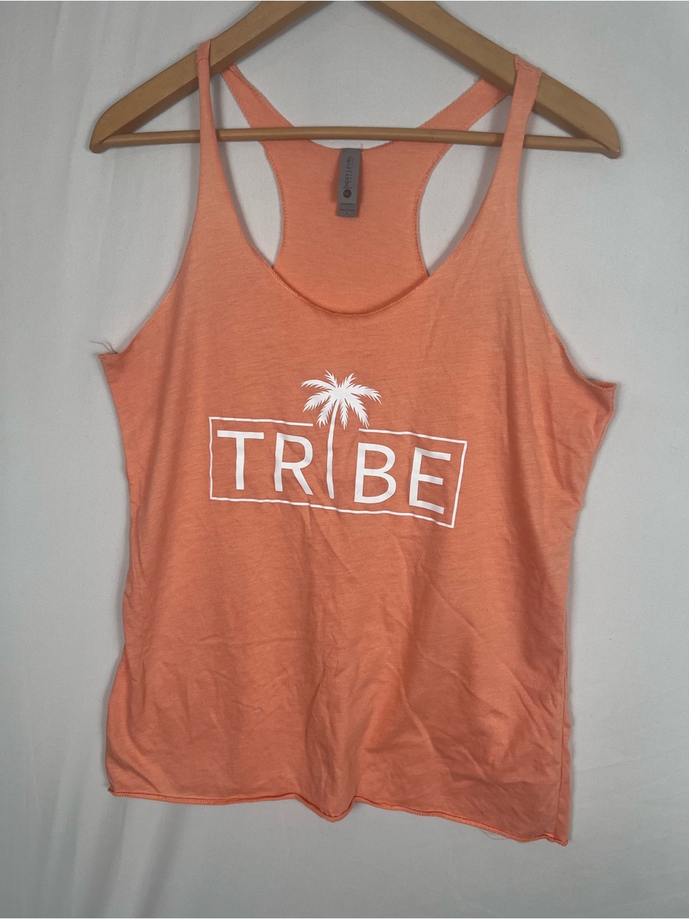 Next Level Apparel Coral Racerback Tank with White TRIBE Logo size large